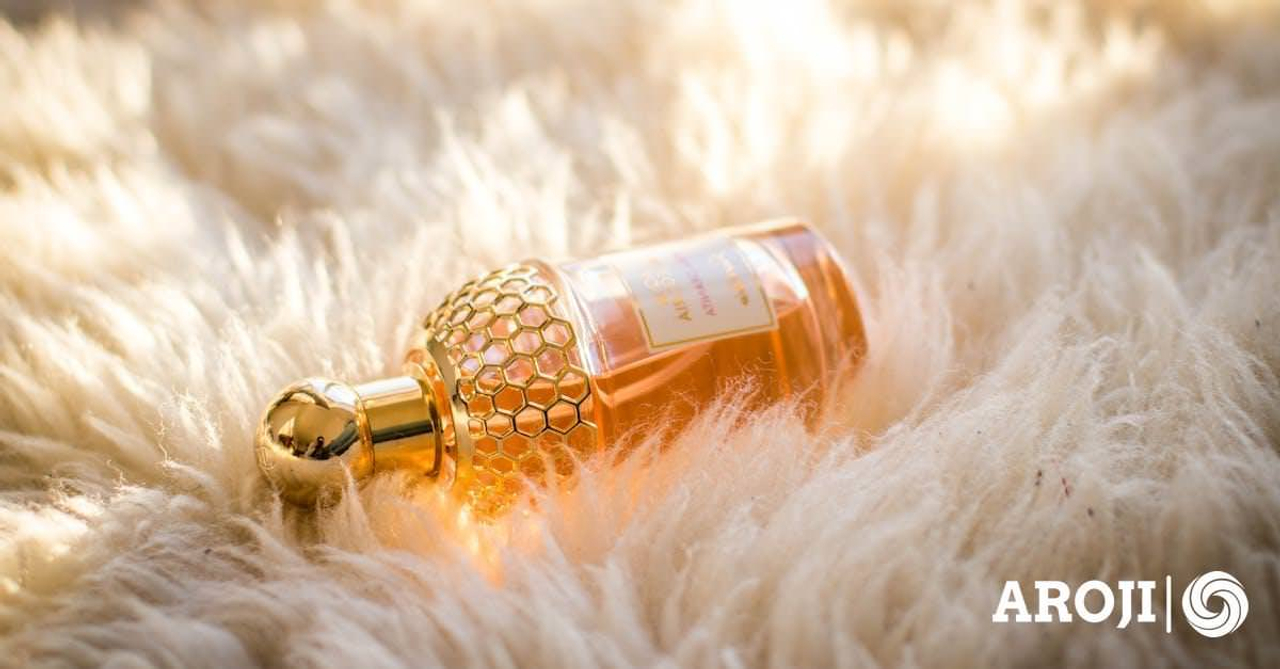 Clear Perfume Bottle on White Fur Textile